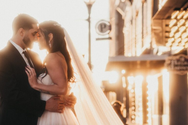 Wedding couple embracing outside the Virginia at sunset