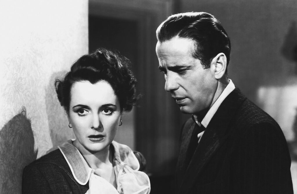 Film still of a man and woman.