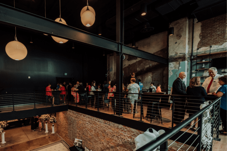 Loft space with people socializing.