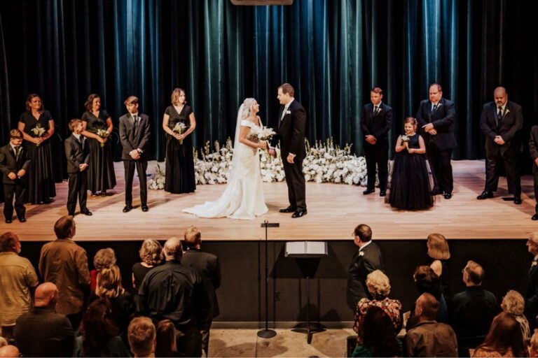 Wedding party on stage during ceremony